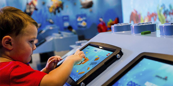 child using a Legoland tablet display